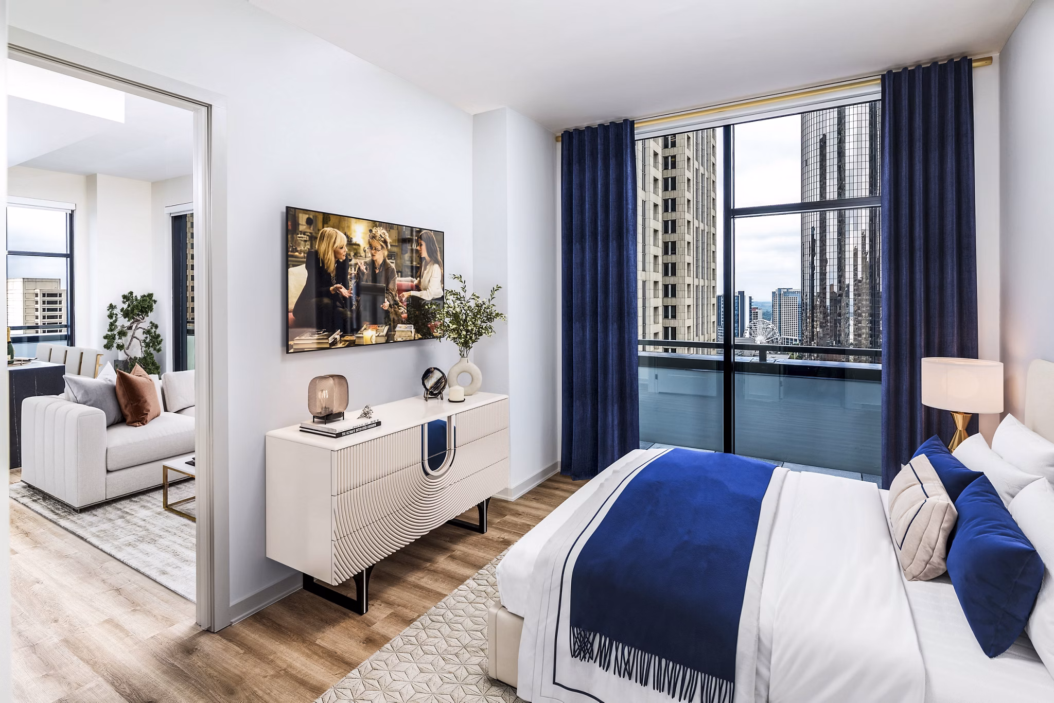 Ascent Peachtree Apartments: Elegant bedroom with city views and modern decor in luxury high-rise