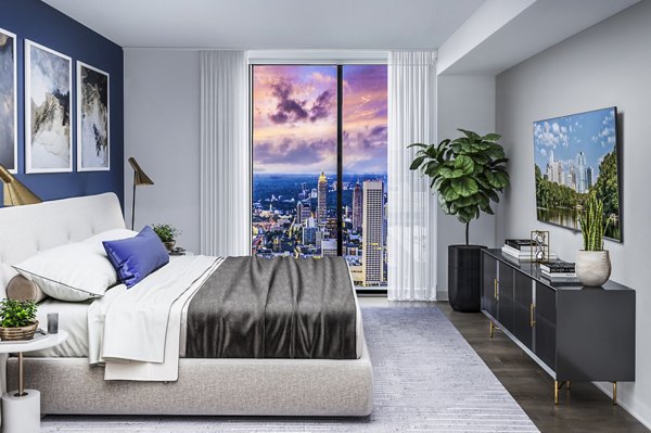 Bedroom featuring elegant decor and city view at Ascent Peachtree Apartments