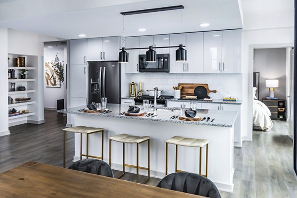 Modern kitchen with stainless steel appliances in Ascent Peachtree Apartments, luxury living in Atlanta