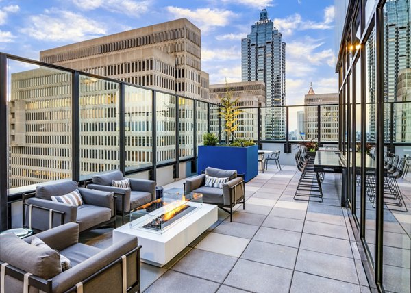 Cozy fire pit on a spacious patio at Ascent Peachtree Apartments, perfect for social gatherings and relaxing evenings in the city