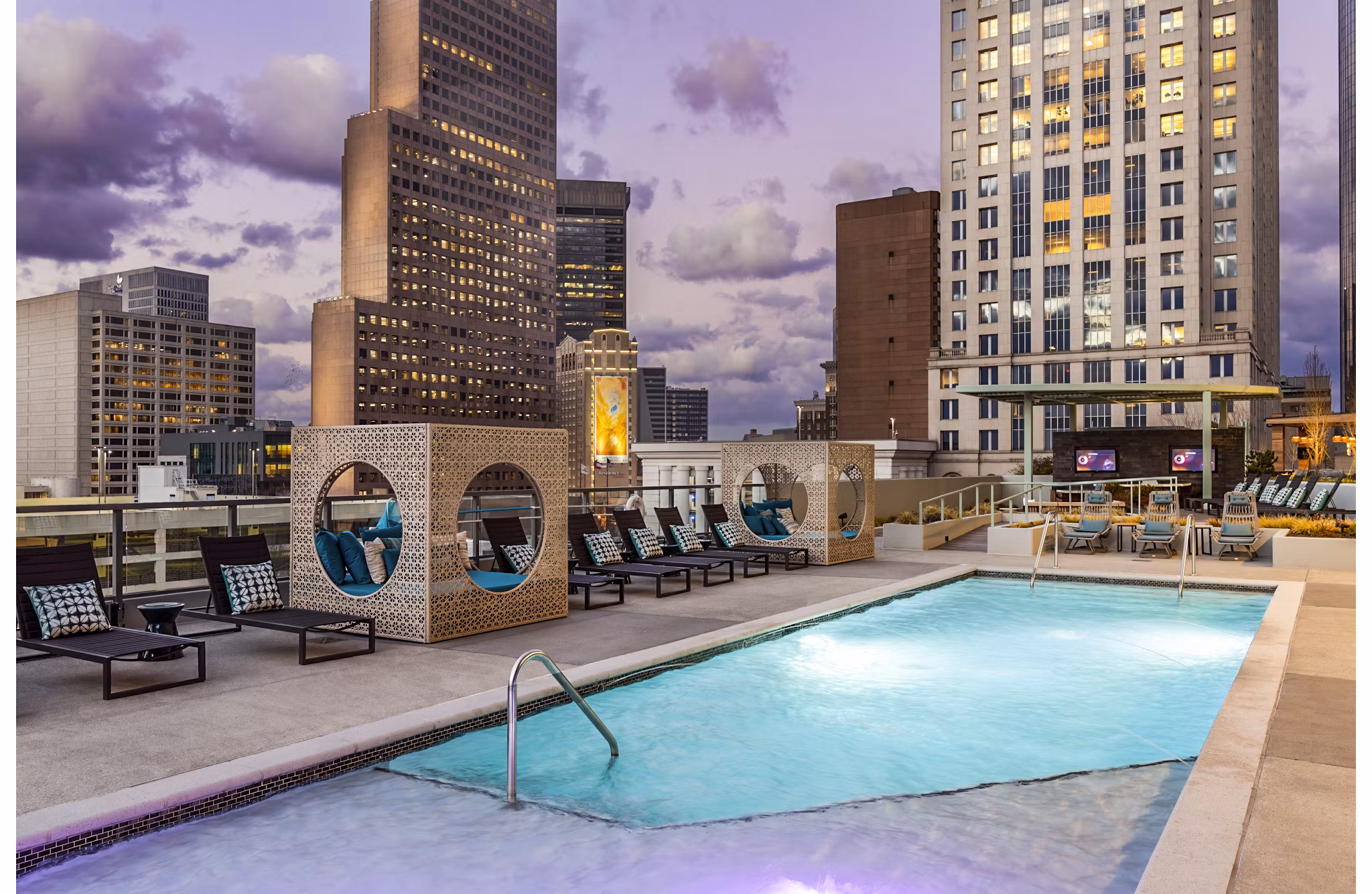 Expansive pool with lounge area at Ascent Peachtree Apartments, perfect for relaxation in the heart of the city