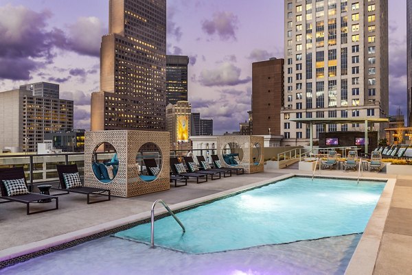 Expansive pool with lounge area at Ascent Peachtree Apartments, perfect for relaxation in the heart of the city