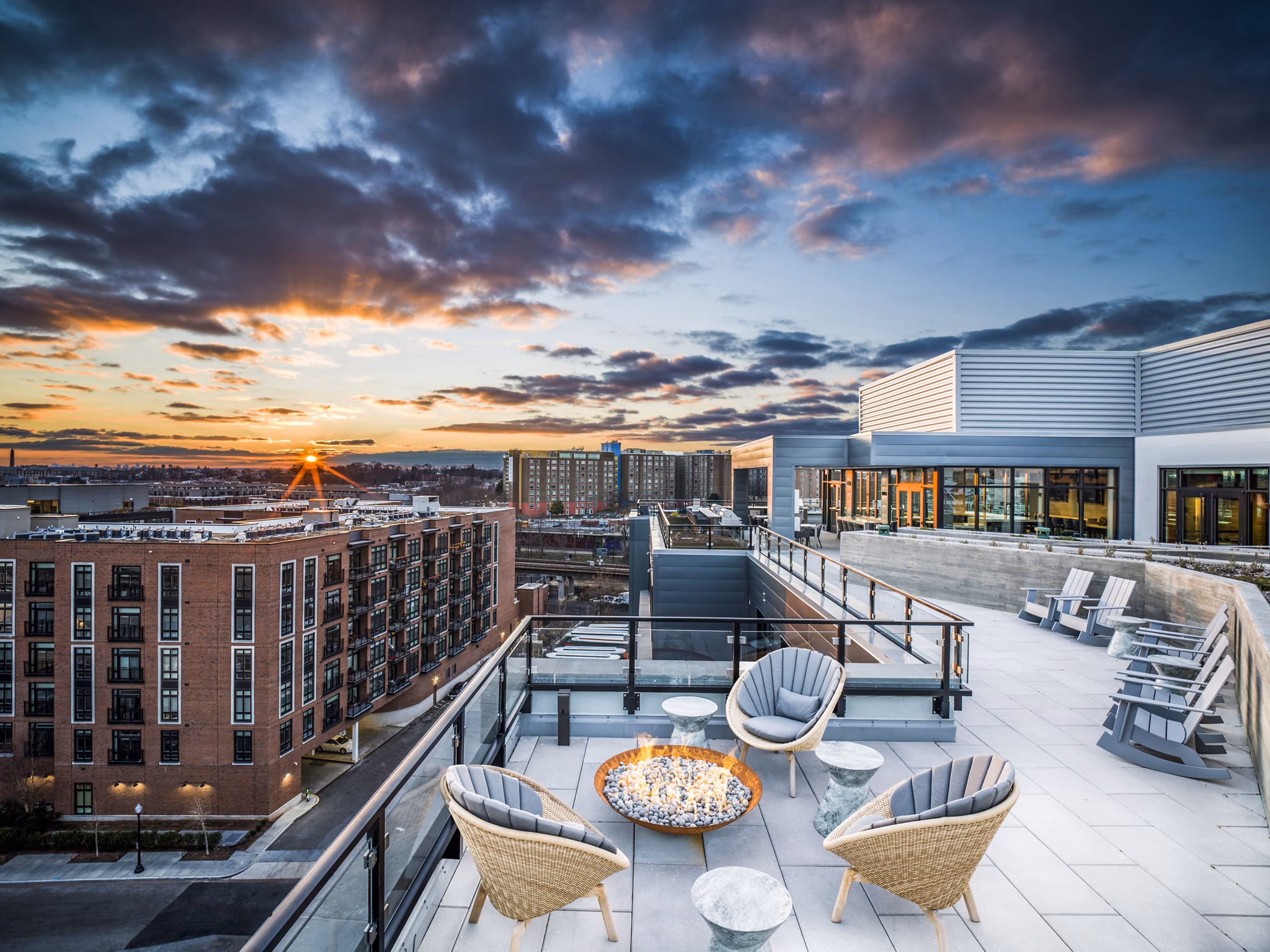 Private patio with modern seating at Rowan Apartments