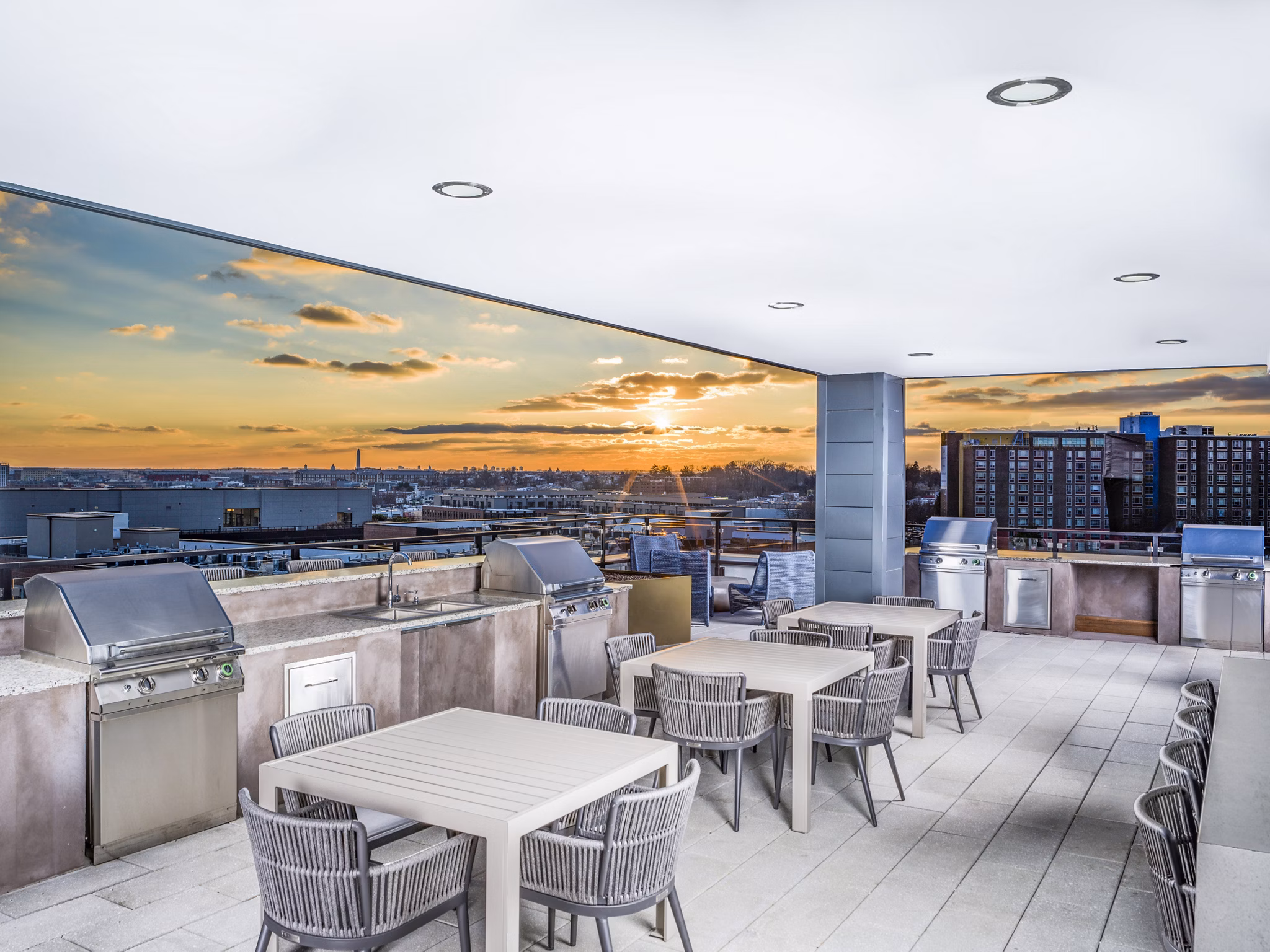 Grill area with modern BBQ facilities at Rowan Apartments in a luxurious outdoor setting for social gatherings