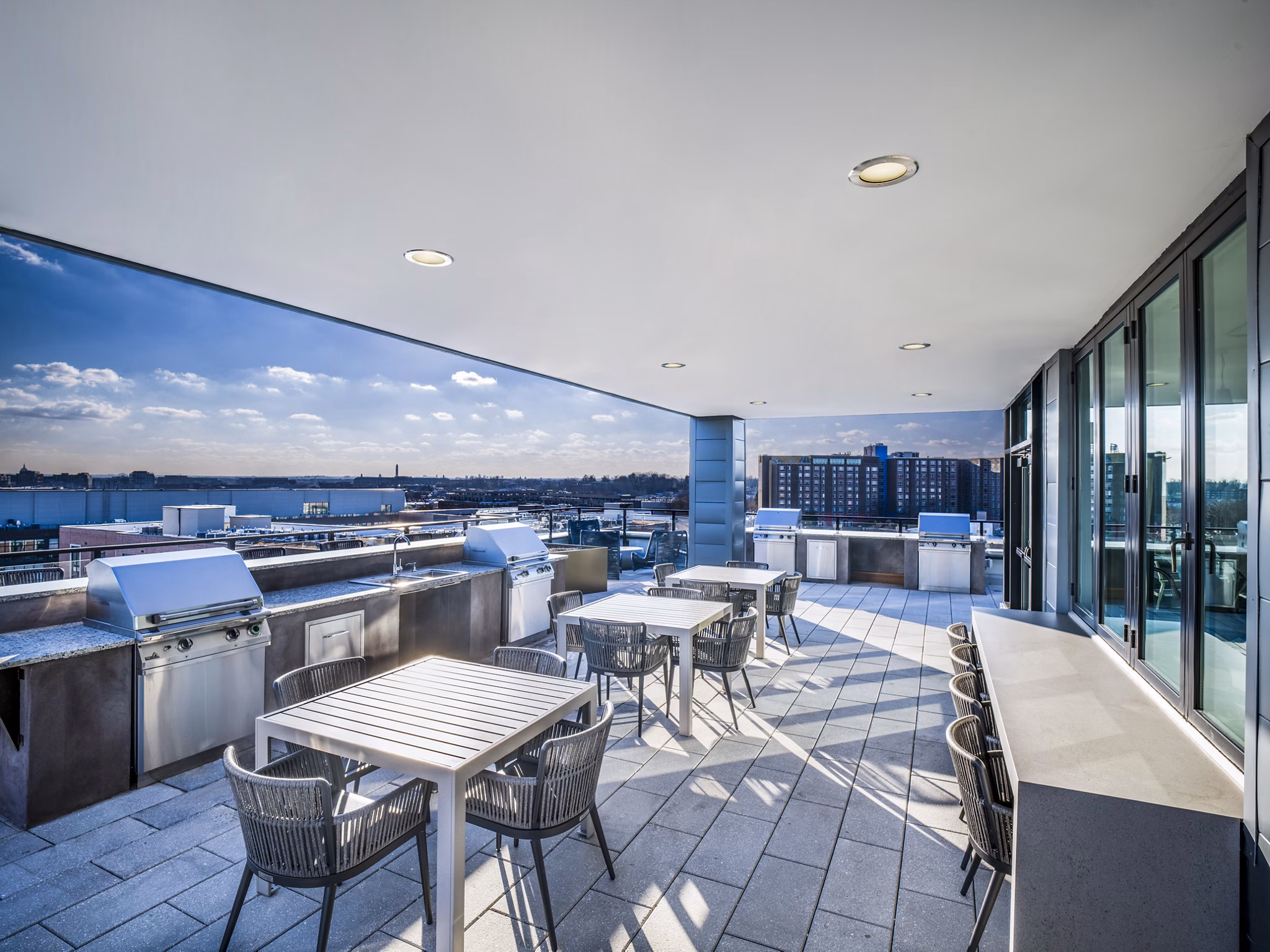 Grill area with modern barbecue stations at Rowan Apartments, a luxury Greystar community