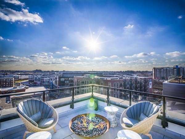 Modern outdoor fire pit on spacious patio at Rowan Apartments