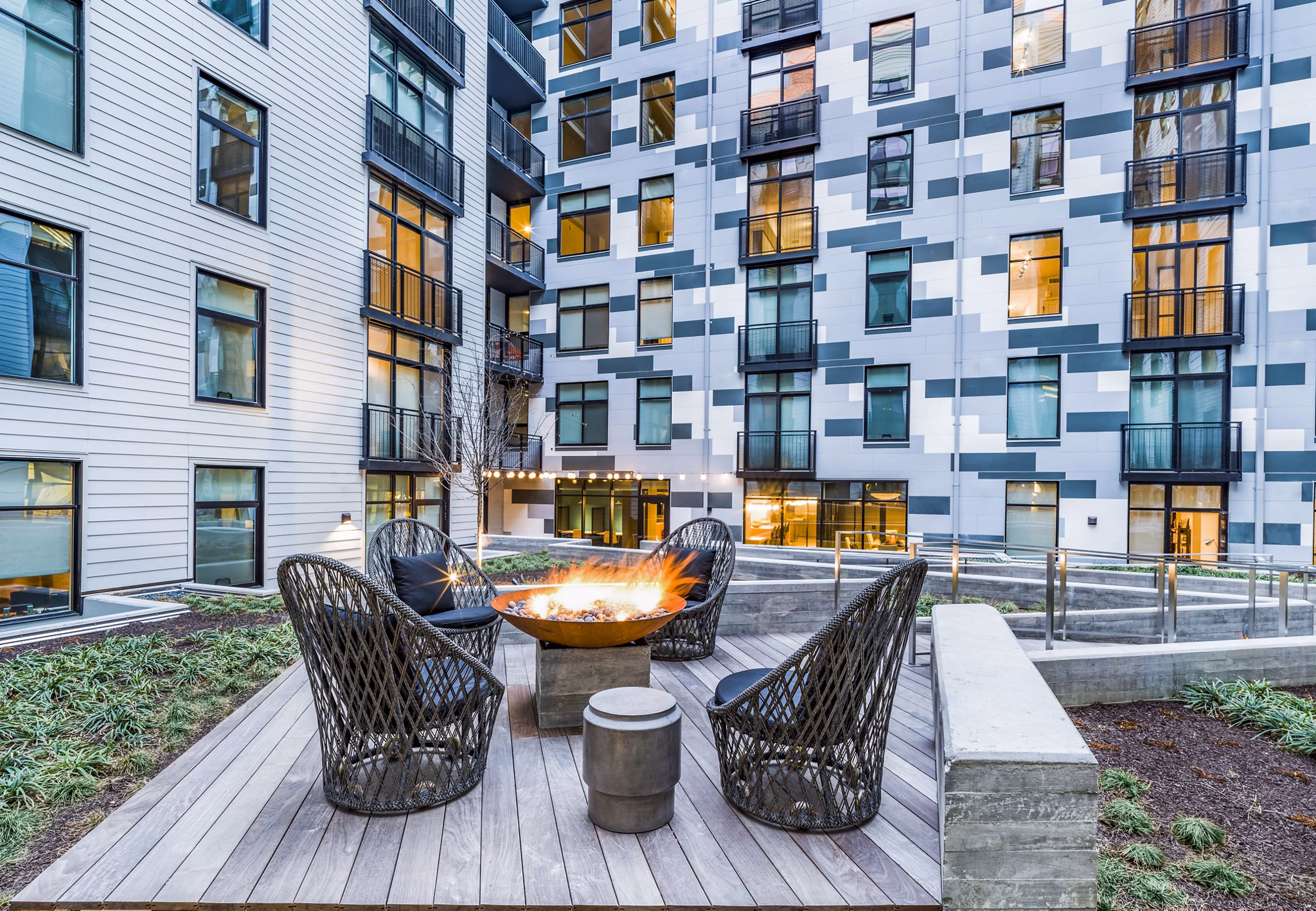 Cozy fire pit area at Rowan Apartments, perfect for evening gatherings and relaxation