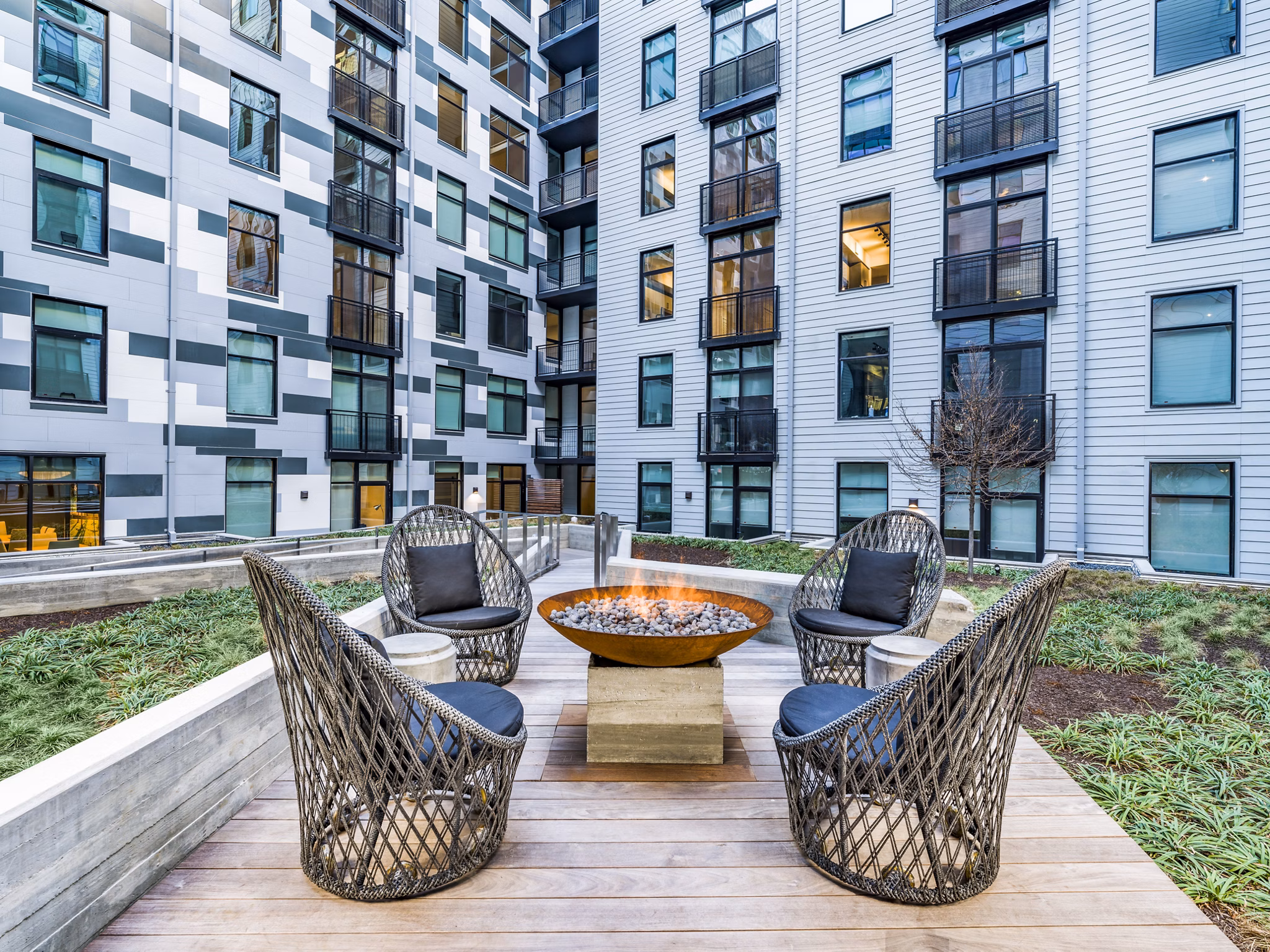 Fire pit lounge area at Rowan Apartments, creating a warm community gathering space