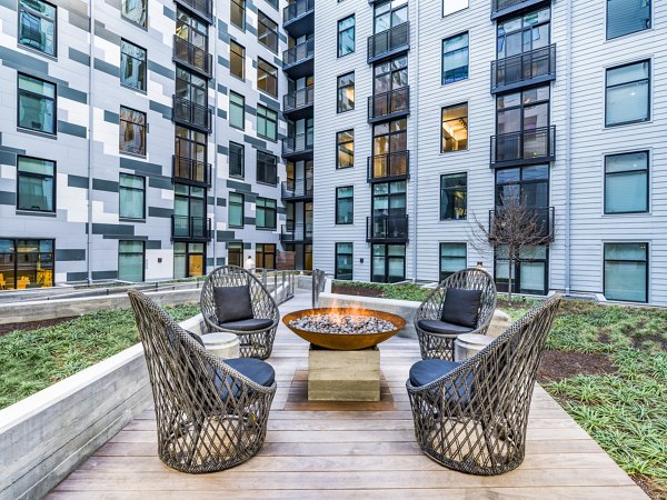 Fire pit lounge area at Rowan Apartments, creating a warm community gathering space