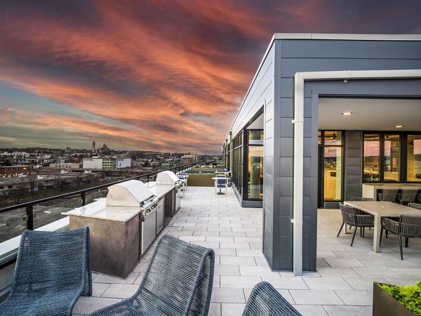 Outdoor grill area at Rowan Apartments featuring modern barbeque stations for resident gatherings