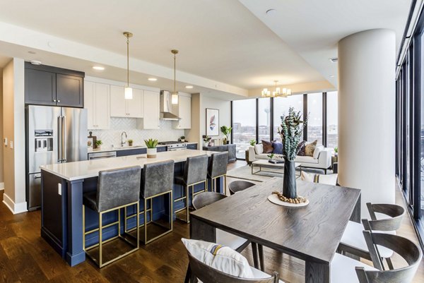 Elegant dining area with modern lighting at The Bower Apartments, perfect for hosting guests in a luxurious setting