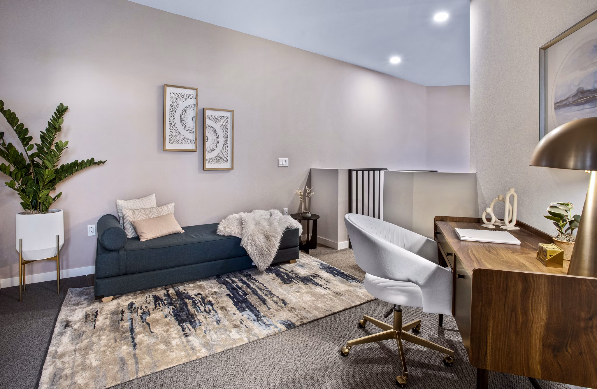 Upstairs office and bedroom with modern decor at Alexan Gallerie Apartments, luxury residence by