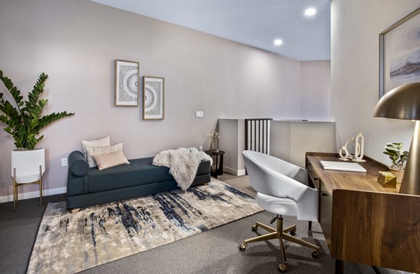 Upstairs office and bedroom with modern decor at Alexan Gallerie Apartments, luxury residence by