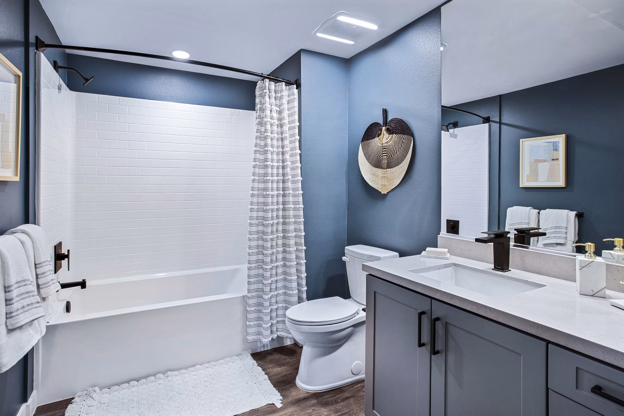 Luxurious bathroom with modern fixtures at Alexan Gallerie Apartments, offering premium living in a stylish Greystar-managed community