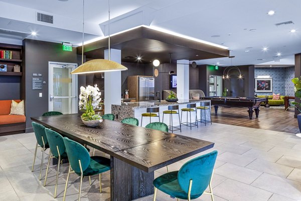 Stylish clubhouse featuring sleek furnishings at Alexan Gallerie Apartments