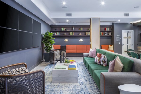Modern clubhouse with stylish seating and entertainment options at Alexan Gallerie Apartments, a Greystar luxury living community