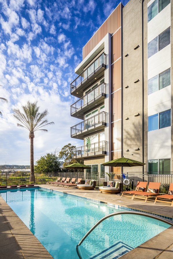 Luxurious outdoor pool at Alexan Gallerie Apartments offering resort-style relaxation and modern amenities