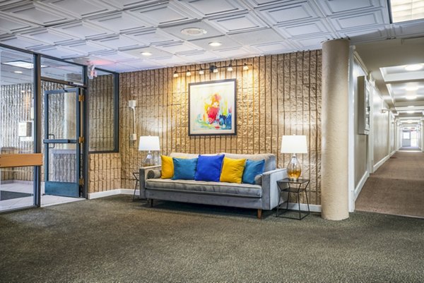 Clubhouse featuring stylish seating and modern decor at Glo Apartments luxury community