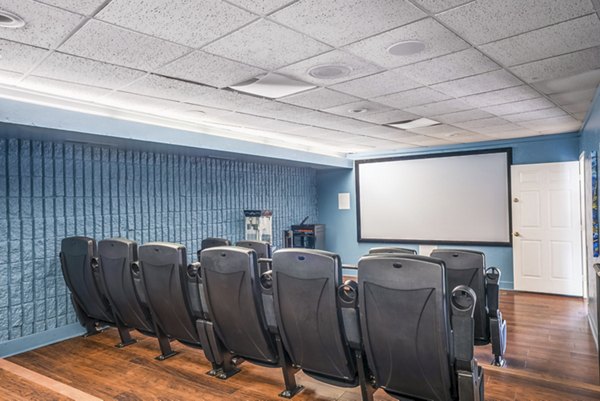 Clubhouse theater featuring plush seating and large screen at Glo Apartments, perfect for movie nights Enjoy luxury amenities in your community