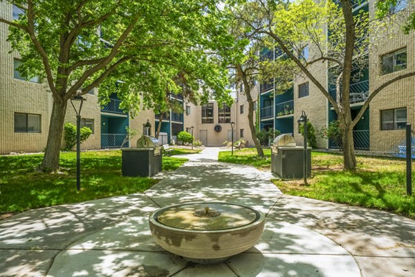 Stylish outdoor grill area and patio at Glo Apartments ideal for social gatherings and relaxation in a luxurious setting