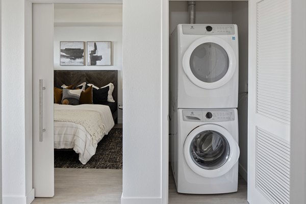 Laundry room with washers and dryers at VOX Apartments, Greystar luxury apartments, providing convenient on-site laundry facilities