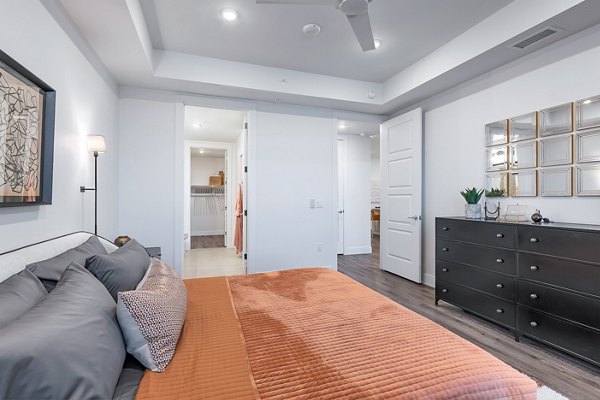 Elegant bedroom with stylish decor at 1155 Barton Springs Apartments, offering modern luxury living in a prime location