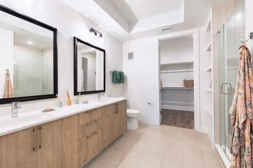 Bathroom with sleek marble countertops and modern fixtures at 1155 Barton Springs Apartments