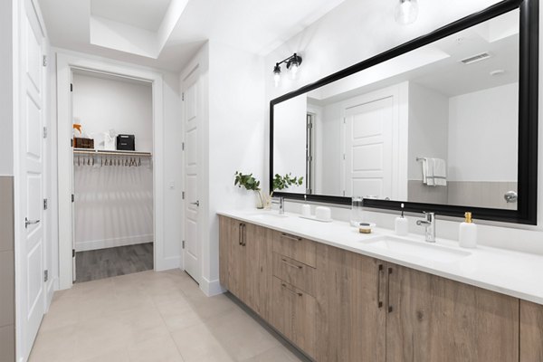 Elegant bathroom with marble sink and modern fixtures at 1155 Barton Springs Apartments