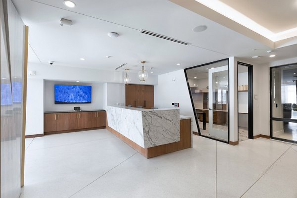 Clubhouse with modern decor at 1155 Barton Springs Apartments, offering luxury leisure spaces for residents