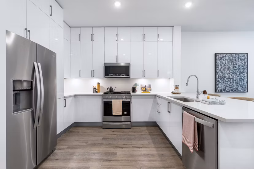 Modern kitchen with stainless steel appliances at 1155 Barton Springs Apartments