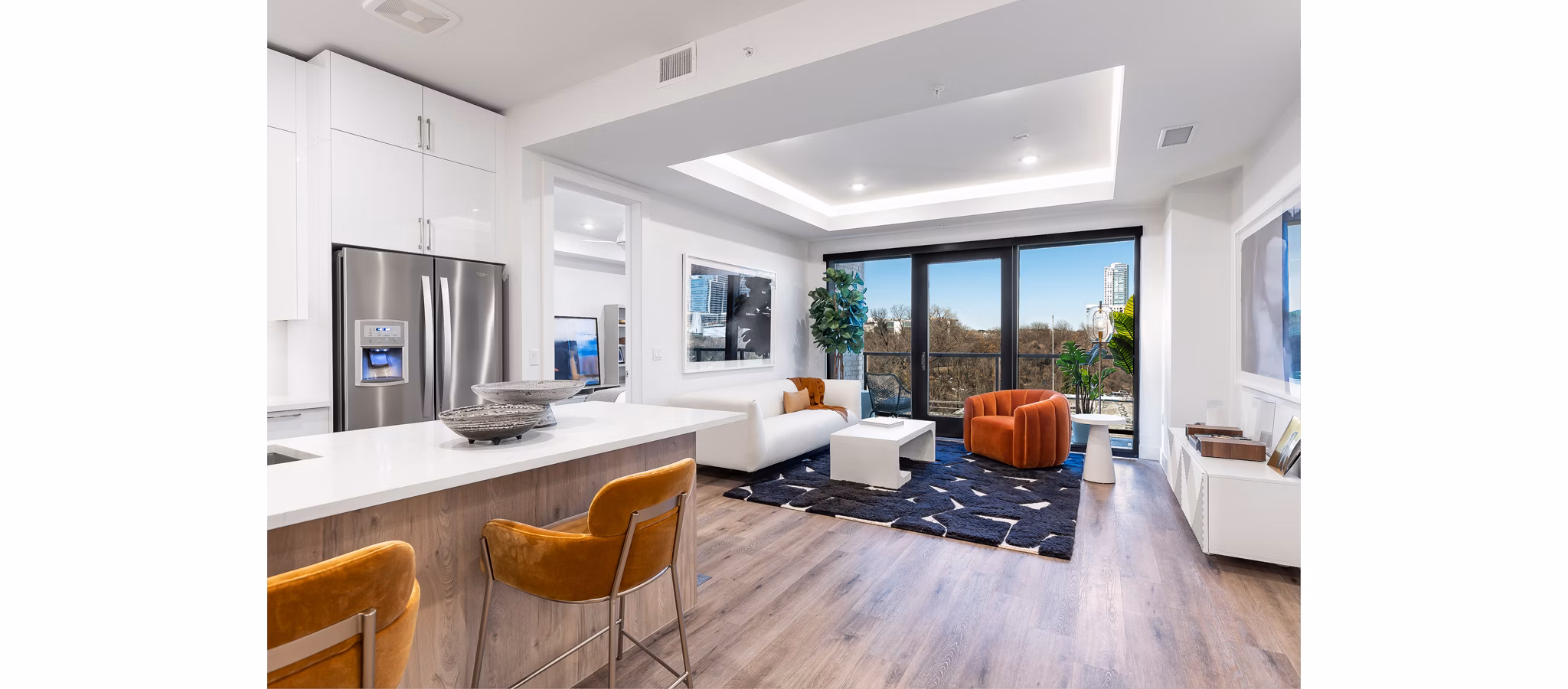 Modern kitchen with stainless steel appliances at 1155 Barton Springs Apartments, luxury homes in Austin