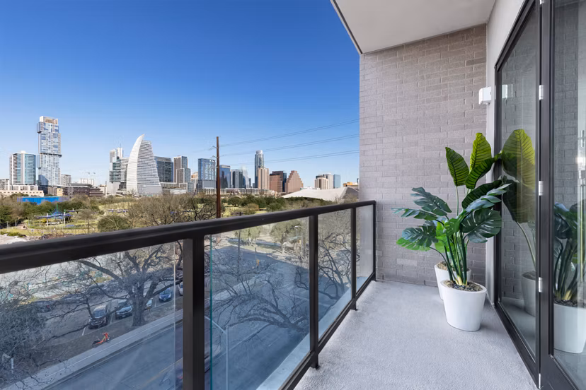 Private patio with scenic views at 1155 Barton Springs Apartments, a luxury Greystar community in downtown Austin