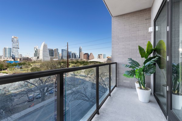 Private patio with scenic views at 1155 Barton Springs Apartments, a luxury Greystar community in downtown Austin