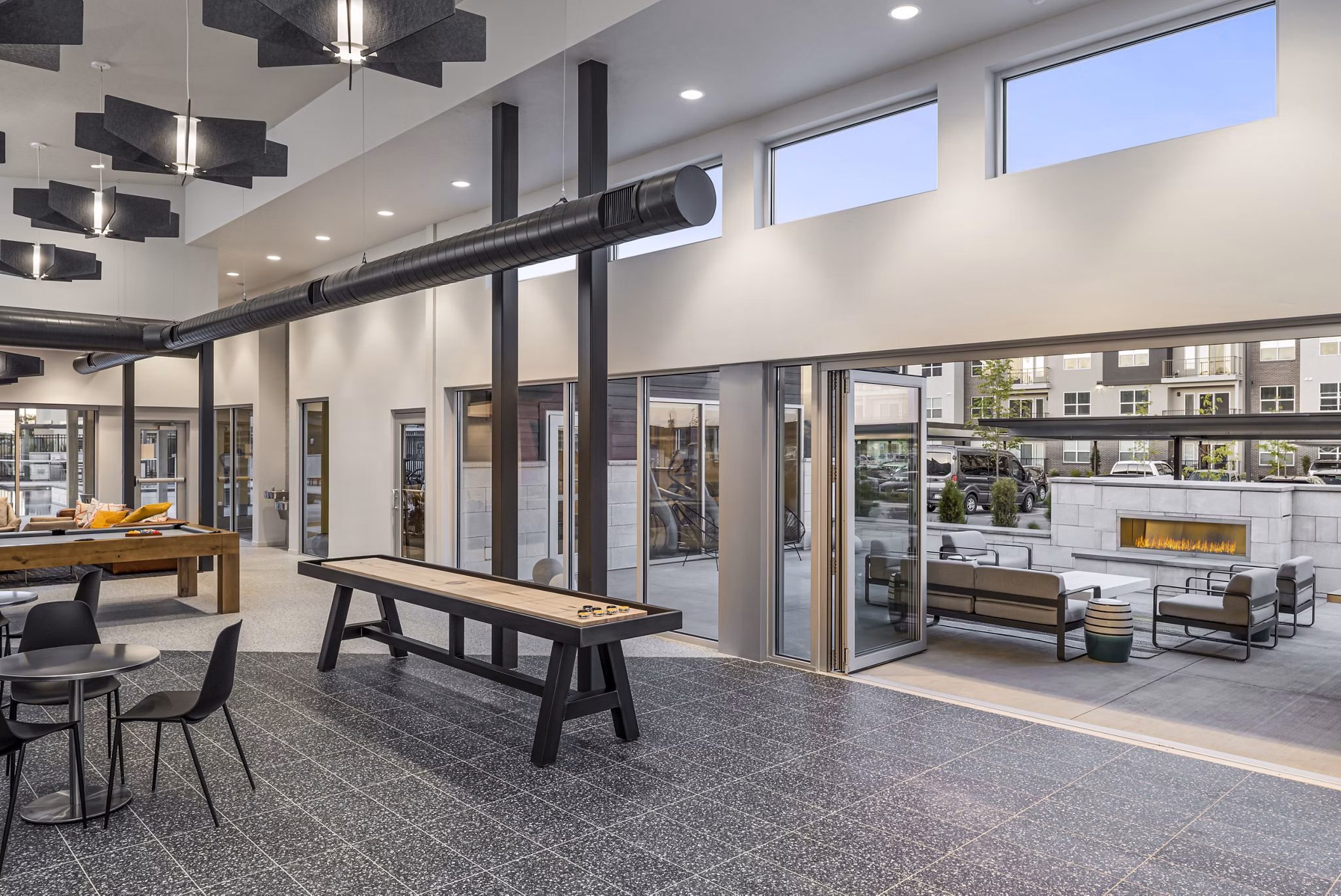 The Lofts at Ten Mile: Outdoor patio with fire pit for cozy evenings at luxury apartments
