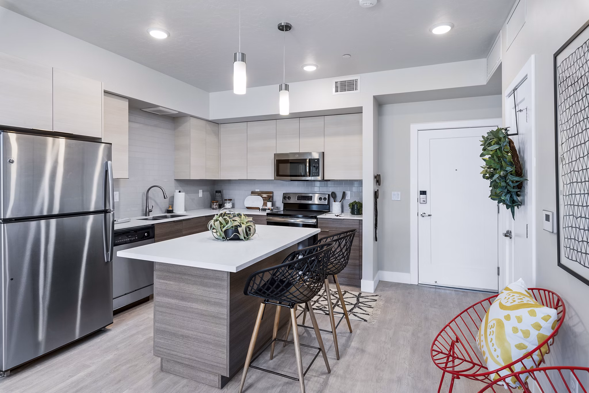 Modern kitchen with stainless steel appliances in The Lofts at Ten Mile Apartments