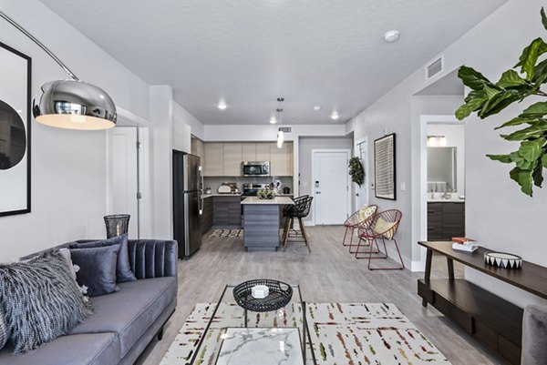 Modern living room with plush seating and natural light at The Lofts at Ten Mile Apartments
