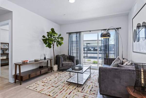 Modern living room with sleek design features at The Lofts at Ten Mile Apartments