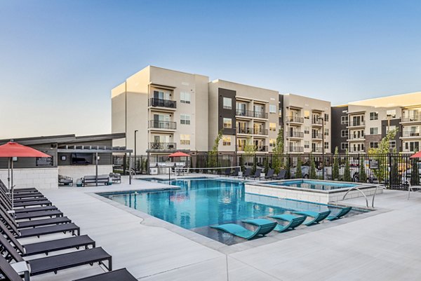 Resort-style pool at The Lofts at Ten Mile Apartments, offering relaxation and recreation in a luxury living setting