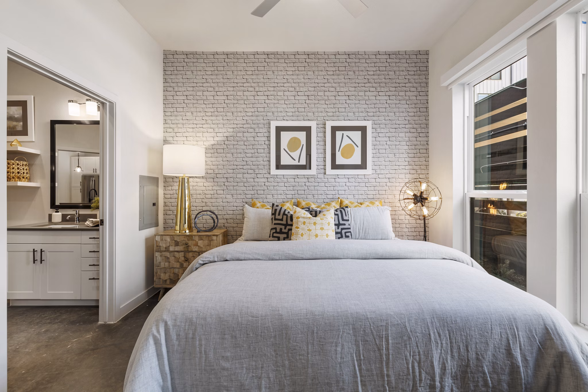 Elegant bedroom with modern decor at Art House Sawyer Yards Apartments, offering luxury living in a vibrant community setting