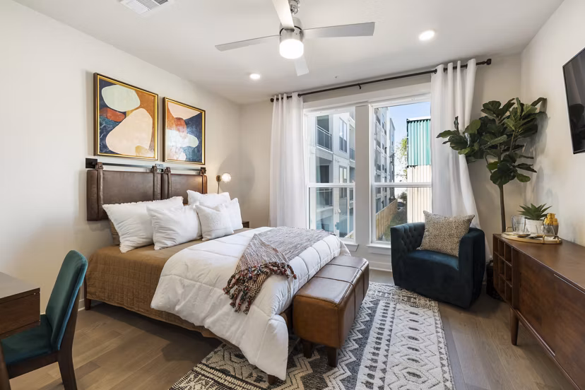 Cozy bedroom with minimalist decor at Art House Sawyer Yards Apartments