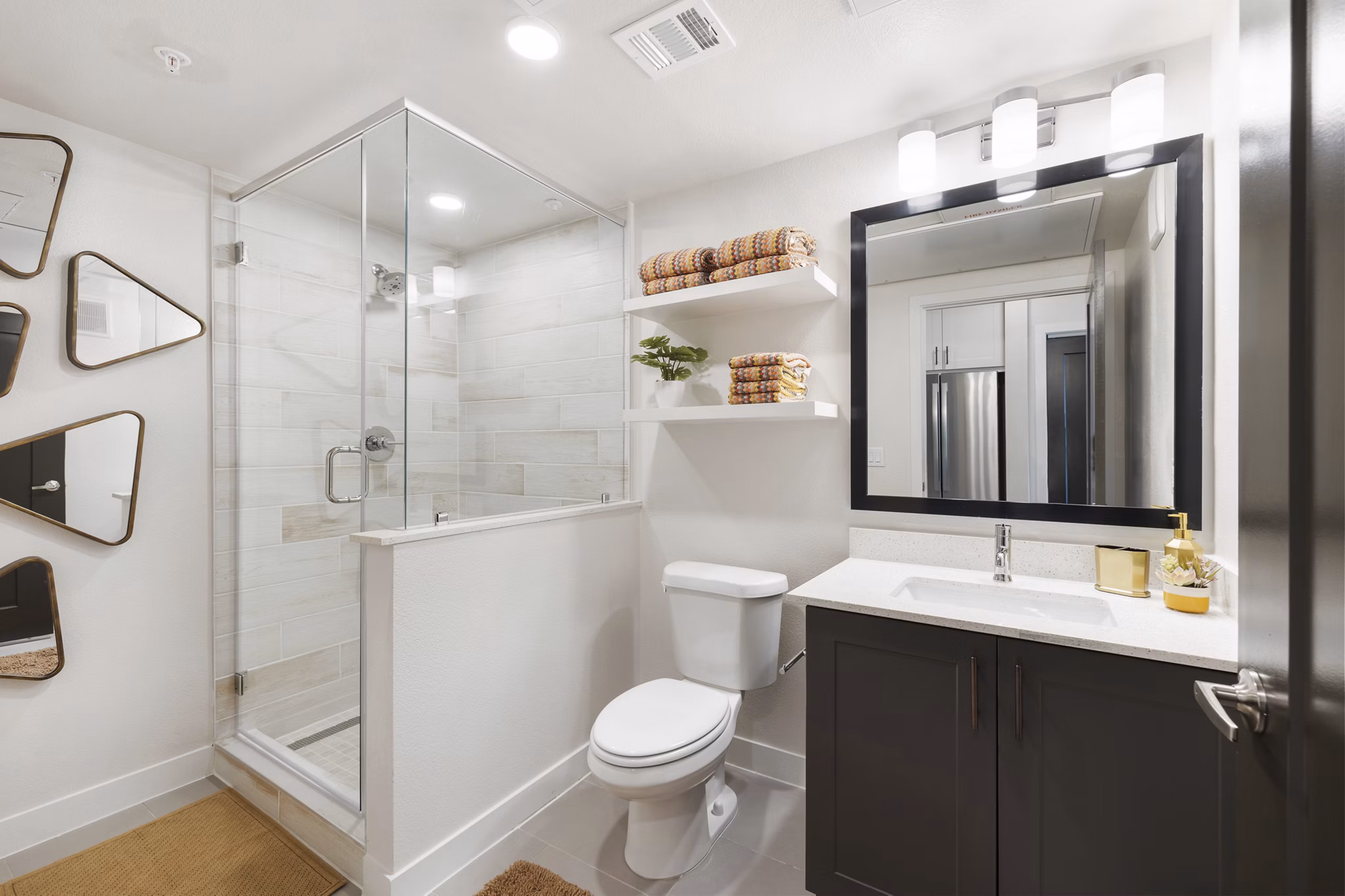 Bathroom with modern fixtures and sleek design at Art House Sawyer Yards Apartments in Houston