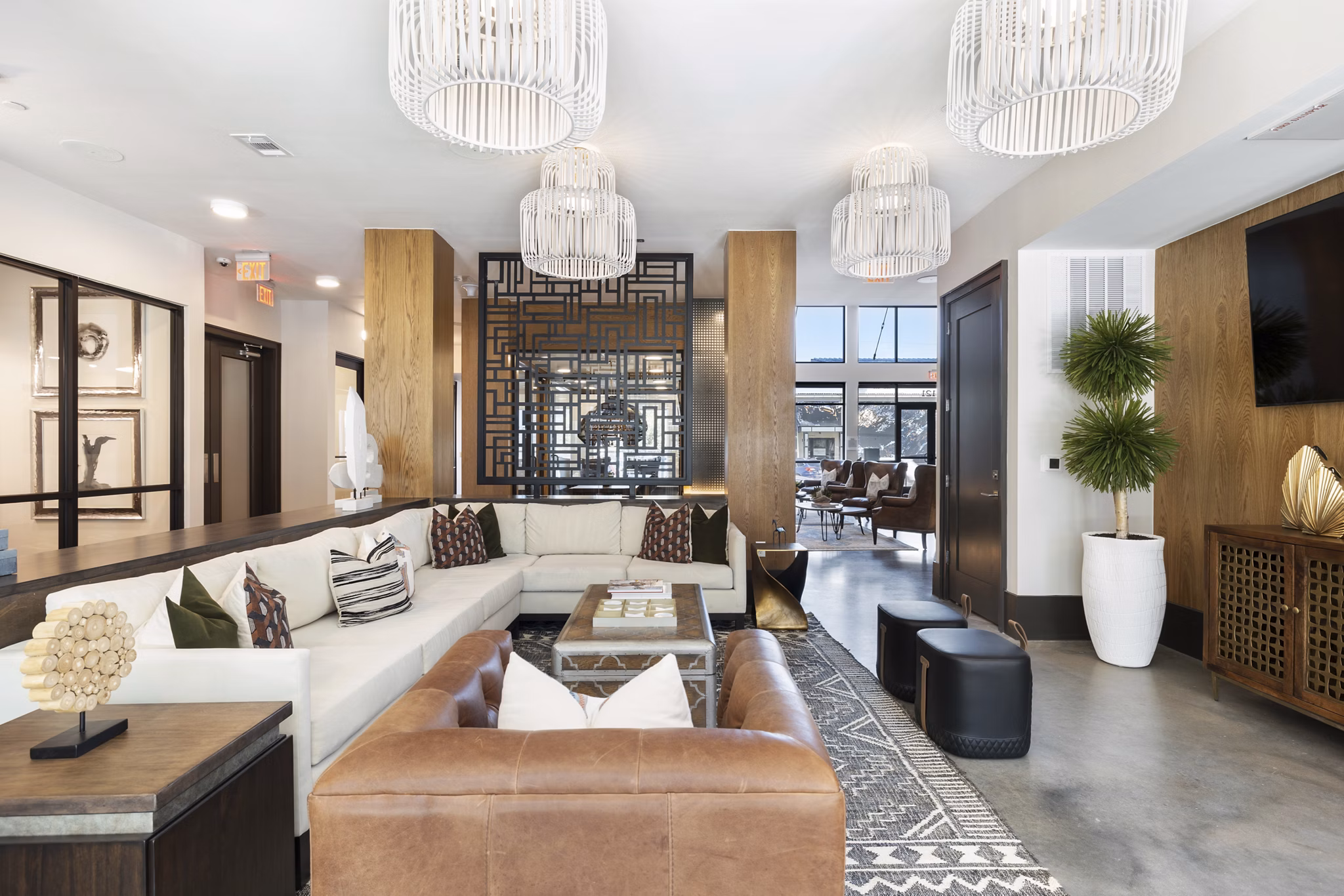 Clubhouse featuring modern design and seating areas at Art House Sawyer Yards Apartments in an urban setting