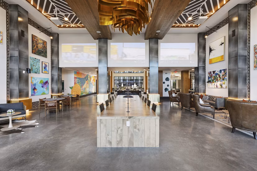 Modern clubhouse with stylish lounge seating at Art House Sawyer Yards Apartments