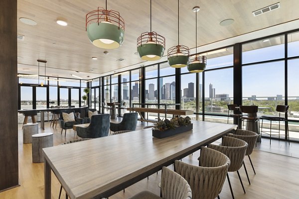 Clubhouse with modern design at Art House Sawyer Yards Apartments featuring open spaces and stylish seating