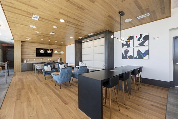 Clubhouse featuring modern design elements at Art House Sawyer Yards Apartments in a luxury community