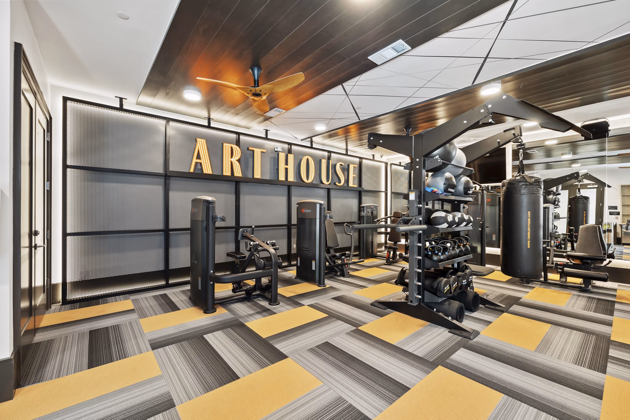 Modern fitness center featuring state-of-the-art equipment at Art House Sawyer Yards Apartments