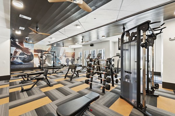 State-of-the-art fitness center with modern equipment at Art House Sawyer Yards Apartments, ideal for active lifestyles