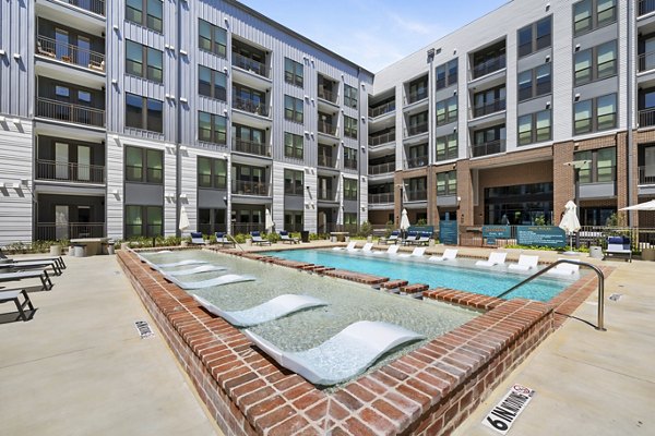 Rooftop pool offering skyline views at Art House Sawyer Yards Apartments, a luxury residential community in Houston