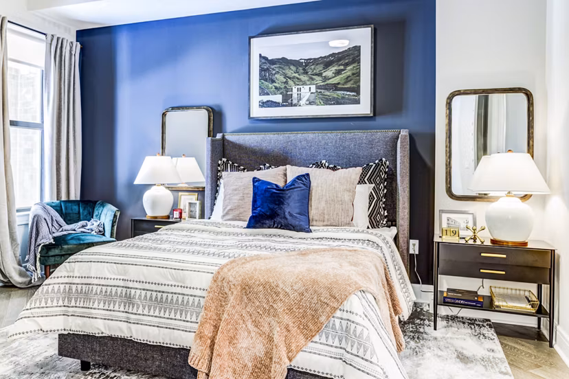 Comfortable bedroom with modern furnishings at The Bowen Apartments