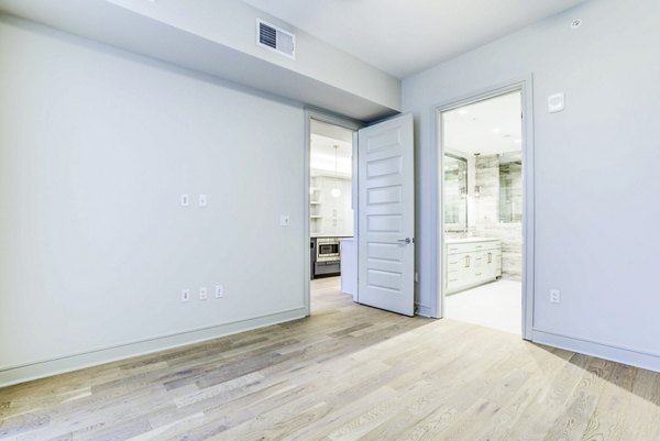 Contemporary bedroom with modern decor at The Bowen Apartments